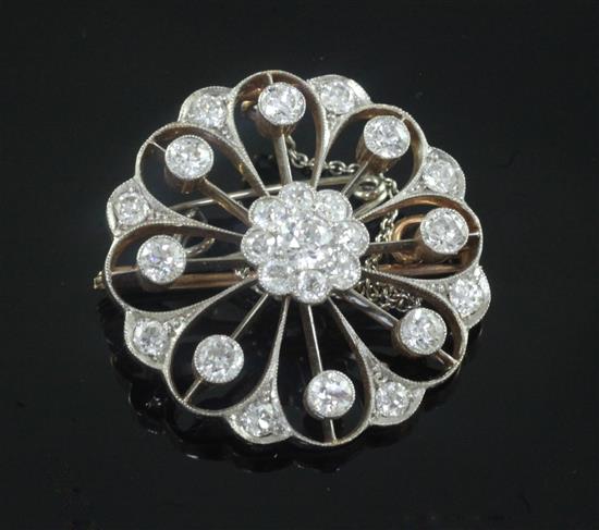 A Victorian style gold, platinum and diamond openwork circular pendant brooch, 26mm.